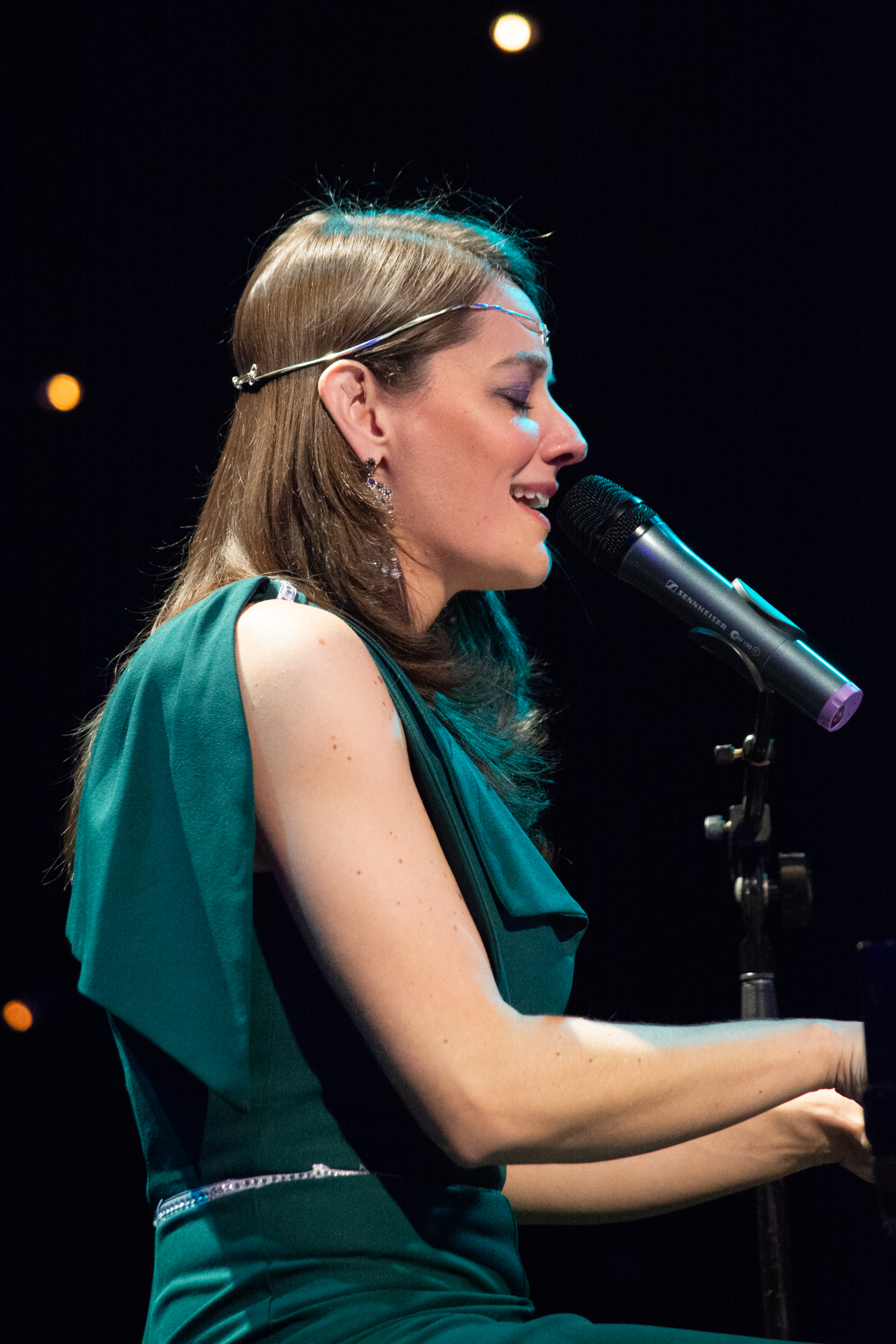 Jackie playing piano and singing